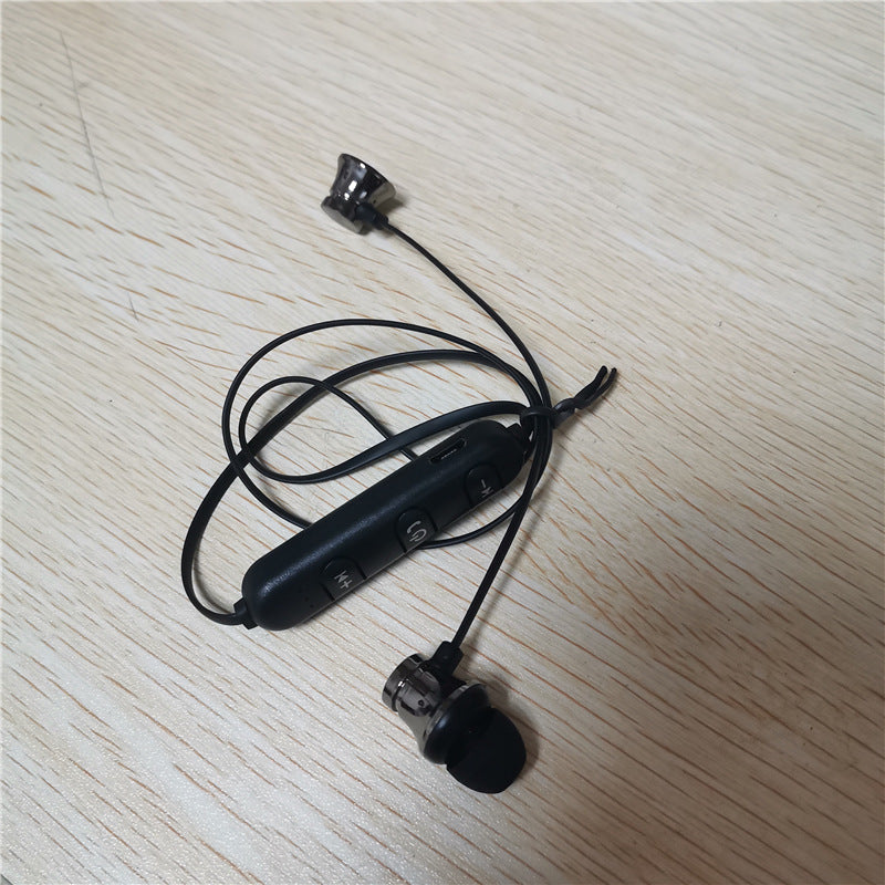 Grey Magnetic Wrap Around Earbuds On Table